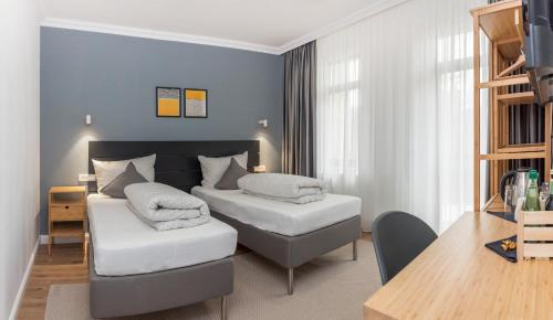 Postel nebo postele na pokoji v ubytování Martin Boutique Hotel
