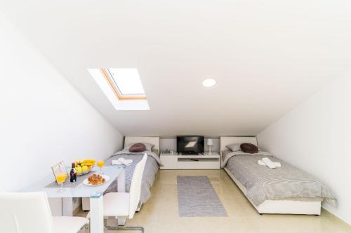 Ένα ή περισσότερα κρεβάτια σε δωμάτιο στο Apartments Šmanjak