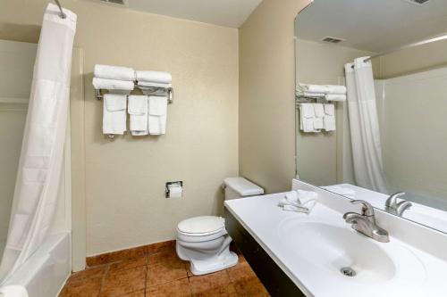a bathroom with a sink and a toilet and a shower at Quality Inn Rawlins I-80 in Rawlins