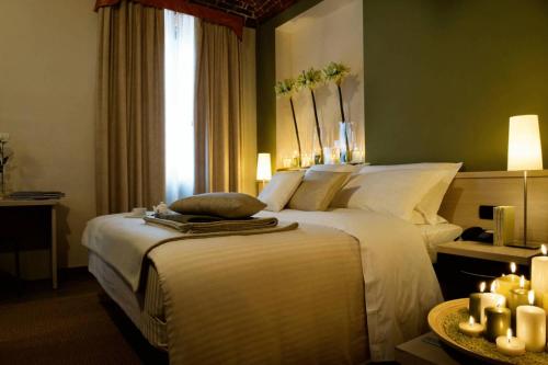 Ένα ή περισσότερα κρεβάτια σε δωμάτιο στο Albergo D'italia