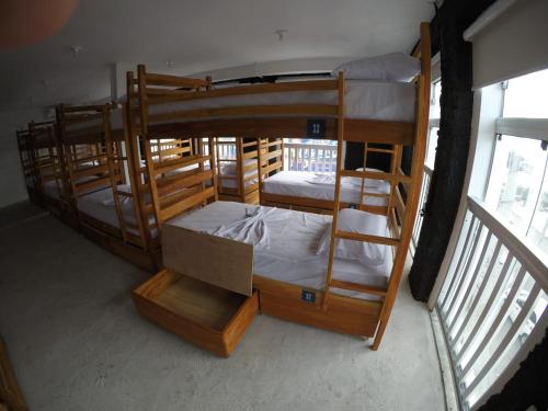 a group of bunk beds in a room at Manhatã Hostel in Salvador