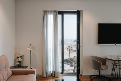 Μια τηλεόραση ή/και κέντρο ψυχαγωγίας στο Hotel Neptuno Playa & Spa