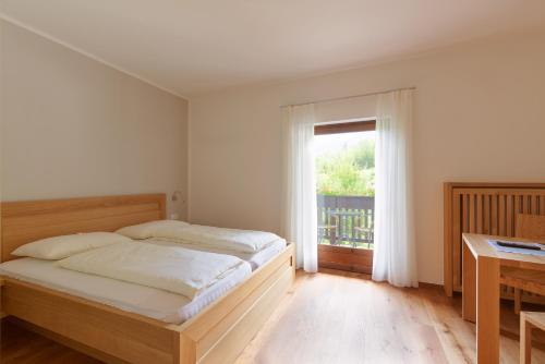 Postel nebo postele na pokoji v ubytování BNB Garni Kreithof