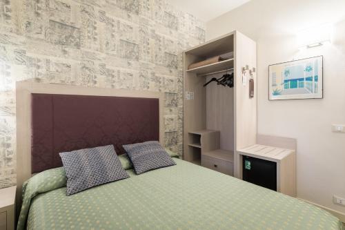 Katil atau katil-katil dalam bilik di Hotel Pardini