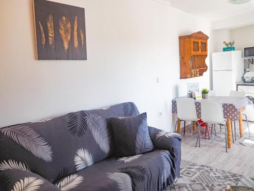 a living room with a couch and a table at ConilPlus apartment SANTA CATALINA III in Conil de la Frontera