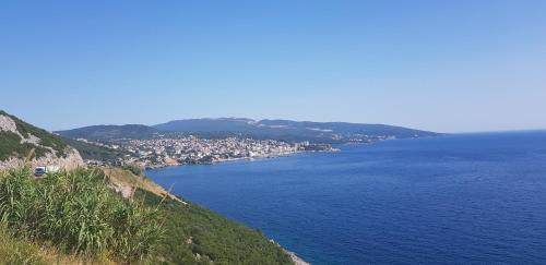 a large body of water with a town on a hill at Monte Liza in Dobra Voda