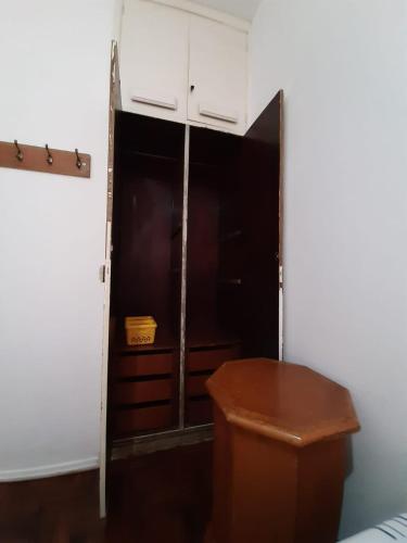 a room with a closet with a toilet in it at Yellow Hostel Praia da Costa in Vila Velha
