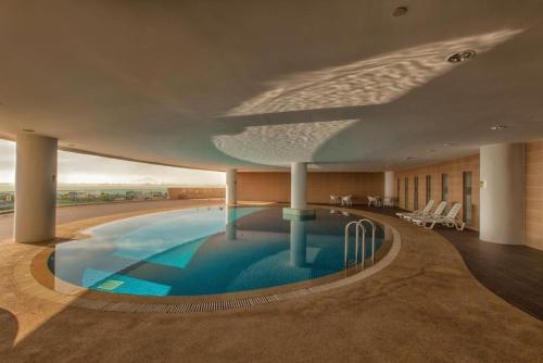 a rendering of a swimming pool in a building at 118 Residences by Travovo in George Town