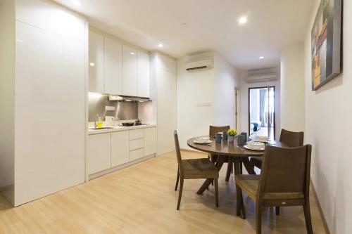 a kitchen and dining room with a table and chairs at 118 Residences by Travovo in George Town