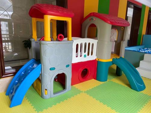 a toy playset with a slide in a room at SSAW Boutique Hotel Lishui Jiarui in Lishui