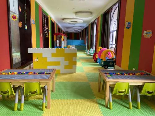 a room with two tables and chairs in a lego room at SSAW Boutique Hotel Lishui Jiarui in Lishui