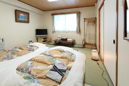 Postel nebo postele na pokoji v ubytování Hotel Tateshina