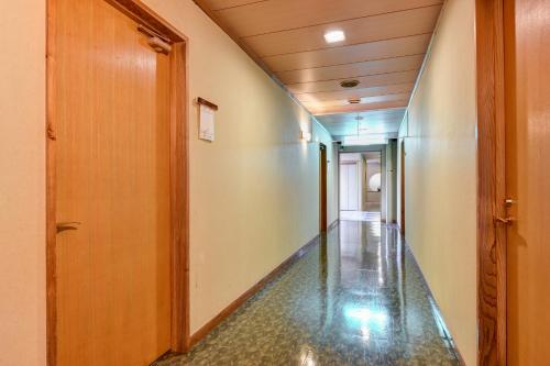 an empty hallway with a shiny floor at Annex Fujiya Ryokan in Kaminoyama