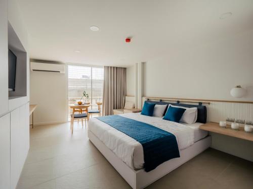 Ένα ή περισσότερα κρεβάτια σε δωμάτιο στο Blu 395