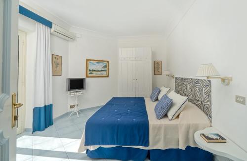 Ένα ή περισσότερα κρεβάτια σε δωμάτιο στο Luxury Villas Positano