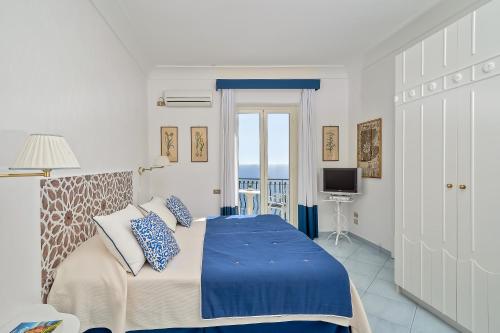 Ένα ή περισσότερα κρεβάτια σε δωμάτιο στο Luxury Villas Positano