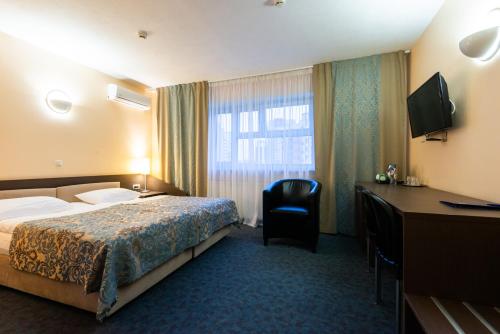 Ένα ή περισσότερα κρεβάτια σε δωμάτιο στο IBB Hotel