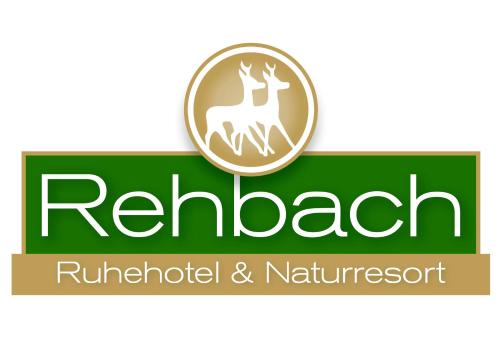 a green sign with a logo for a reubenrothroth and natchez at Ruhehotel & Naturresort Rehbach - Adults only in Schattwald