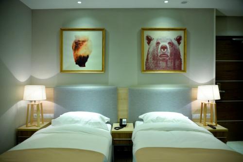Posteľ alebo postele v izbe v ubytovaní GREEN Which Hotel