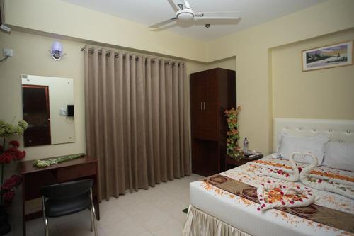 Llit o llits en una habitació de Hotel Vista Bay