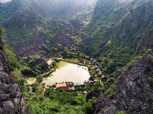an aerial view of a village on the side of a mountain at An's Eco Garden Resort in Ninh Binh