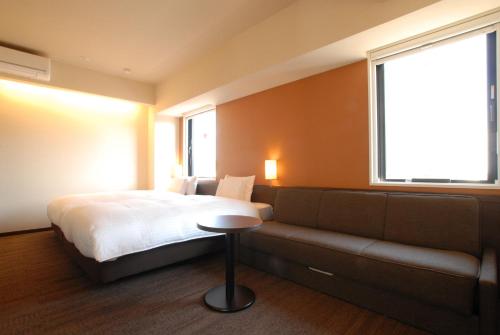 Postel nebo postele na pokoji v ubytování AB Hotel Nara