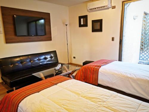 Cama o camas de una habitación en Apart Hotel Viva Providencia