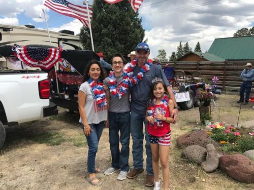 a family posing for a picture in front of a truck at Grandview Cabins & RV Resort in South Fork