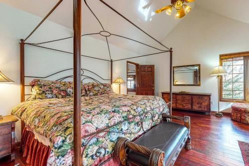 a bedroom with a large bed with a canopy at Wayne Creek Residence in Avon
