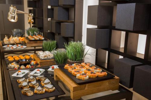 a buffet with many different types of food on display at Kin Plaza Arjaan by Rotana in Kinshasa