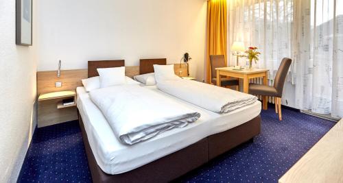 Un ou plusieurs lits dans un hébergement de l'établissement Hotel Bayern Vital