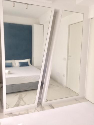 Ένα ή περισσότερα κρεβάτια σε δωμάτιο στο S'O Suites Tropea