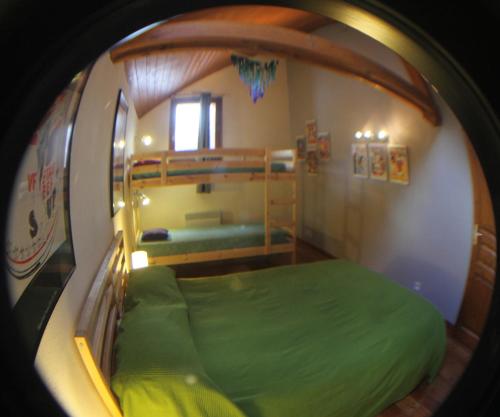 a room with two bunk beds and a round room at B&B La Borella Casa Conti in Vallouise