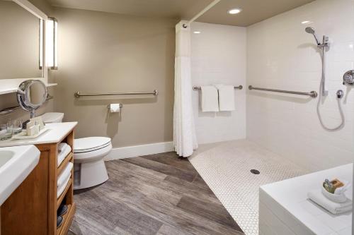 a bathroom with a toilet sink and a shower at L'Auberge De Sedona in Sedona