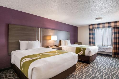 a hotel room with two beds and a window at Quality Inn & Suites Missoula Westside in Missoula