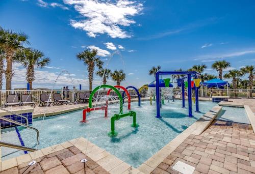 a pool with a water park with a water slide at Dunes Village in Myrtle Beach