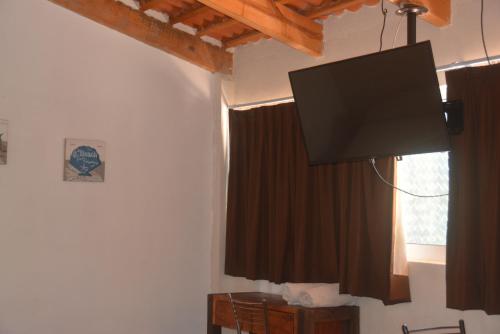 TV a/nebo společenská místnost v ubytování Acapulco Amor