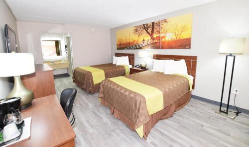 Katil atau katil-katil dalam bilik di Days Inn by Wyndham Midland