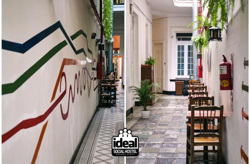 a corridor of a restaurant with tables and chairs at IDEAL SOCIAL Hostel in Buenos Aires