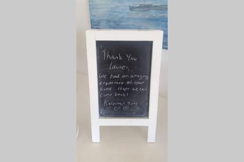 a chalkboard sign with the words worst you lawyer written on it at Sapphire Beach Pet Friendly Beach 5 minute walk in Sapphire Beach