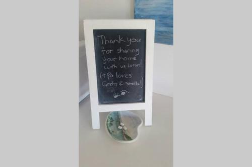 a sign that says thank you for standing your home with your fish in your face at Sapphire Beach Pet Friendly Beach 5 minute walk in Sapphire Beach