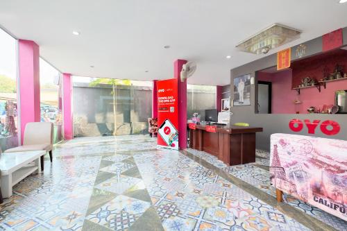 a living room with a colorful tile floor at Tina Boutique Resort in Thalang