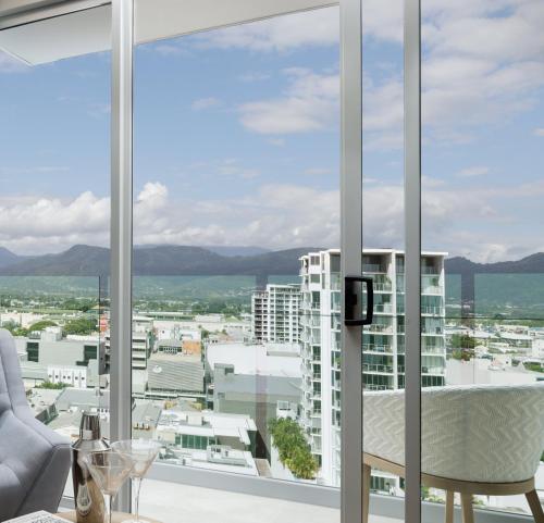 
a hotel room with a view of the city at Crystalbrook Flynn in Cairns
