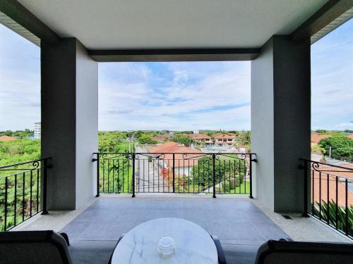 a view from the balcony of a house at The Sala Pattaya - SHA Certified in Jomtien Beach