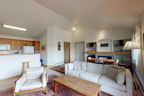 a living room with a couch and a table at Steamboat Springs 1308 in Steamboat Springs