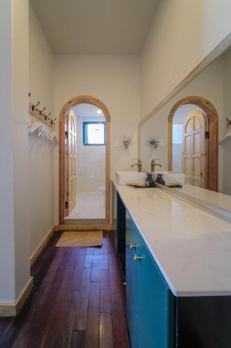 a large bathroom with two sinks and a mirror at Lacasa May in Da Lat