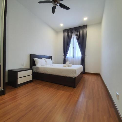 a bedroom with a bed and a window at DaMen Homestay @SubangHomeStay in Subang Jaya