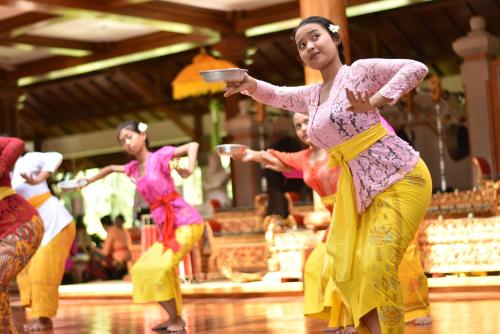 a group of women dancing on a dance floor at The Ayodya Palace in Nusa Dua
