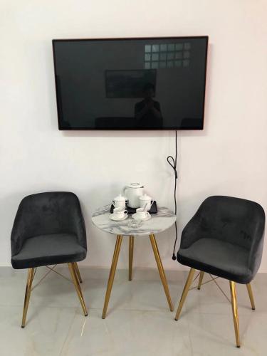 Télévision ou salle de divertissement dans l'établissement Feima Hotel