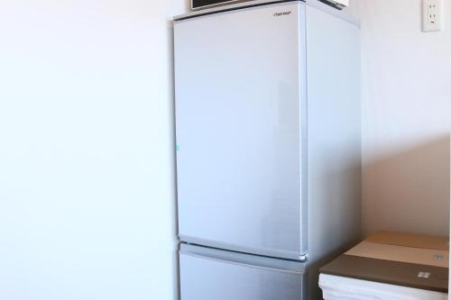 a refrigerator with its door open in a kitchen at SILVER SPRAY MtFuji view Yamanakako in Yamanakako